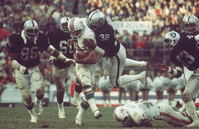 Larry Csonka (center) helped carry the Miami Dolphins to the NFL's last perfect season in 1972.